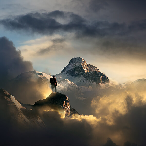 man standing on mountain top